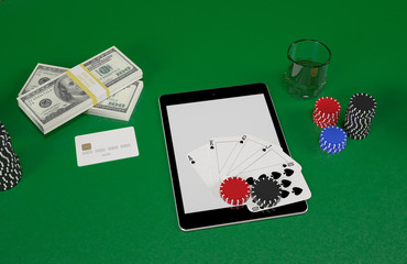Cards and chips for poker on tablet.