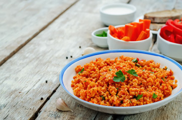 millet porridge with tomato sauce, garlic and parsley