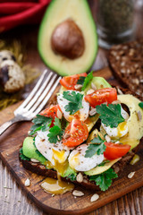 Bruschetta with tomato, avocado and quail egg