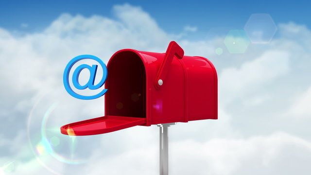 At symbol in the mailbox on cloudy background