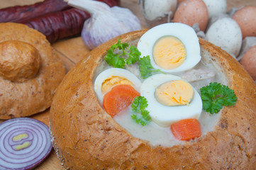Easter white borscht with eggs and sausage in bread bowl