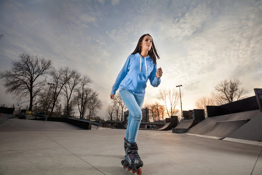 Girl on rollerblades in a skate park