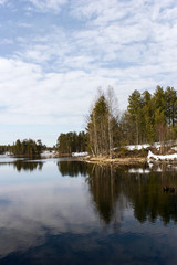 Fototapeta na wymiar Spring landscape. Flow from the lake into Lake Nyukki Petriyarvi