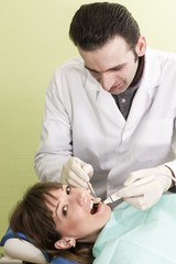 Unshaven dentist examines teeth woman smiling patients