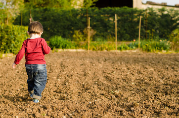 Child in italian rural courtyard
