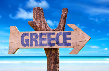 Greece wooden sign with beach background