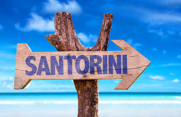 Santorini wooden sign with beach background