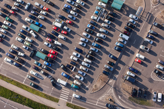 Aerial View Over Crowded  Parking Lot Near Supermarket