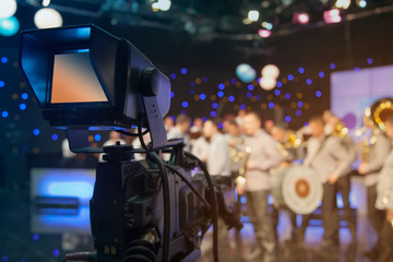Fototapeta na wymiar Television studio with camera and lights - recording TV show