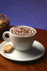 cafe cup served with biscuit