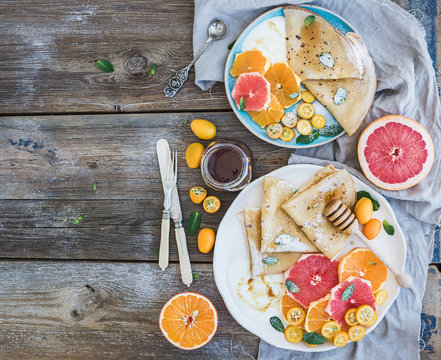 Spring vitamin breakfast set. Thin crepes or pancakes with fresh