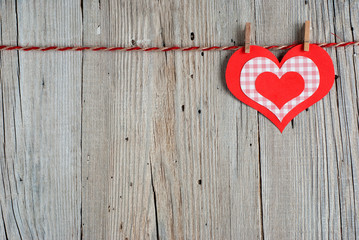 Paper heart on old wooden background