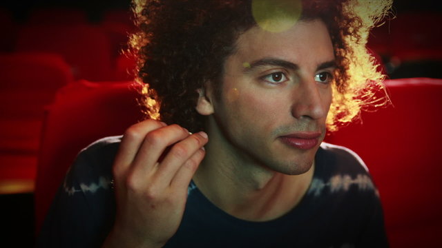 Young man watching a movie
