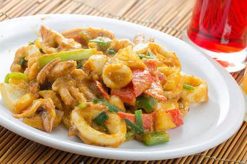fried squid in yellow curry powder, thai food.