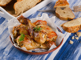 Roasted chicken legs with  fresh herbs.