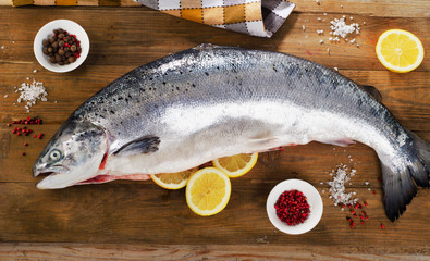 Atlantic Salmon  with lemon on a wooden board