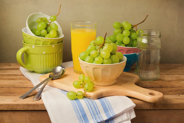 Grapes on wooden table. Still life composition with grapes