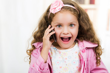 cute little girl using cell phone
