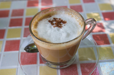 hot cappuccino coffee with cinnamon topping