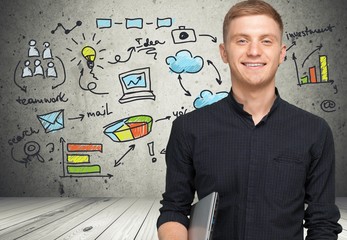 Men. Young student with laptop smiling