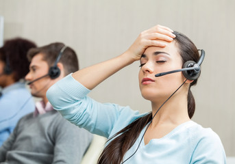 Tired Female Customer Service Agent In Call Center