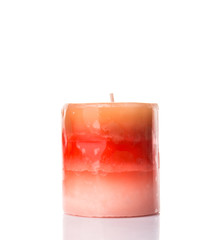 Brown colored aromatic candle over white background