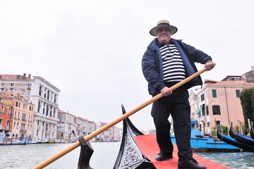 venice italy, gondola driver in grand channel - obrazy, fototapety, plakaty