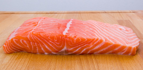 Salmon fillet on a wooden board