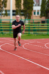 Obraz premium healthy man run on athletics race sport track and representing c