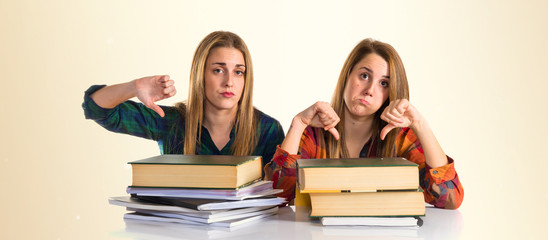 Students doing a bad signal while studying