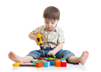 little boy playing on floor