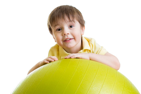 Child Boy Doing Fitness Exercise With Fitness Ball