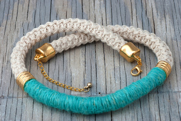 Necklace on old wooden table
