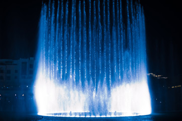 beautiful dancing fountain illuminated at night