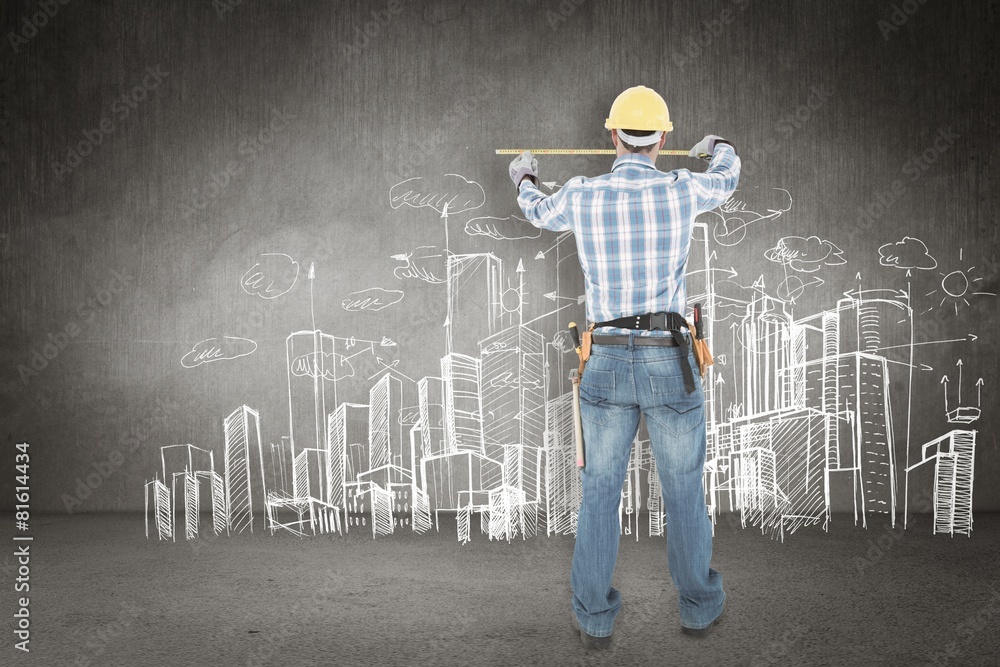 Poster construction worker using measure tape