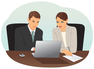 Businessman and businesswoman working with laptop in the office