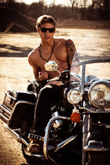 handsome  man on a motorcycle