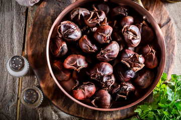 Closeup of roasted chestnuts. with garlic sauce