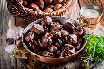 Closeup of hot chestnuts. with garlic sauce