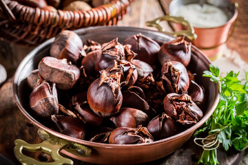 Closeup of homemade chestnuts. with garlic sauce