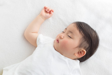 Obraz na płótnie Canvas 熟睡する赤ちゃん