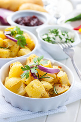 Baked potatoes with chutney and sour cream