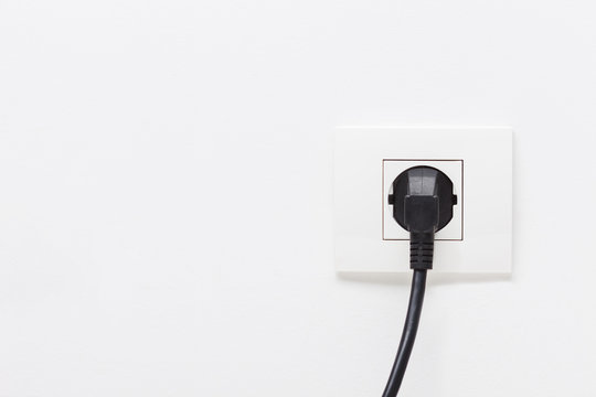 Electric cord plugged into a single electric socket