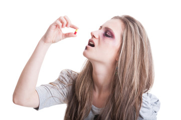 Abused, beaten and injured woman taking antibiotics