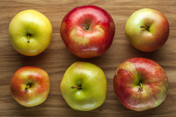Apples on wooden background