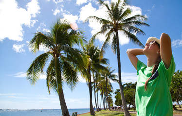 Beach woman with sunglasses and straw hat happy and free