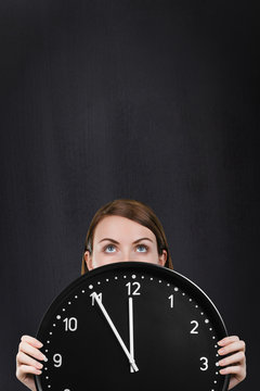 Woman face with a big clock