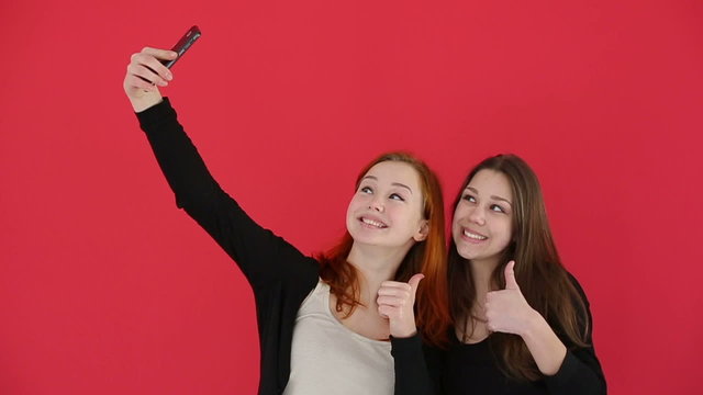 Girls a self portrait with smart phone. Slow motion
