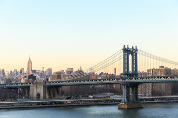 Fototapeta na wymiar New York city sunset with focus on Manhattan Bridge
