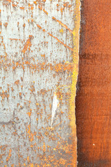 Background vertical image as a steel sheet coated with rust